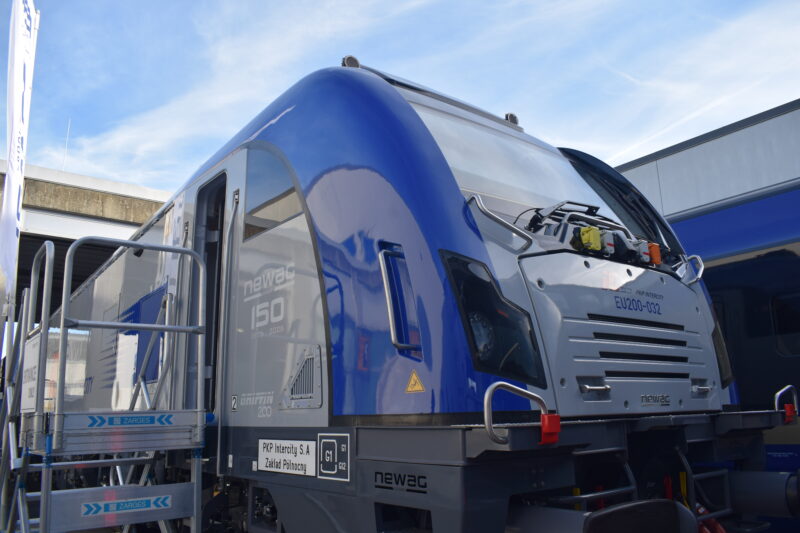 NEWAG's Griffin 200 EU200-032 on display at InnoTrans 2026 in Berlin. The side carries a special logo marking NEWAG's 150th anniversary (1876–2026)