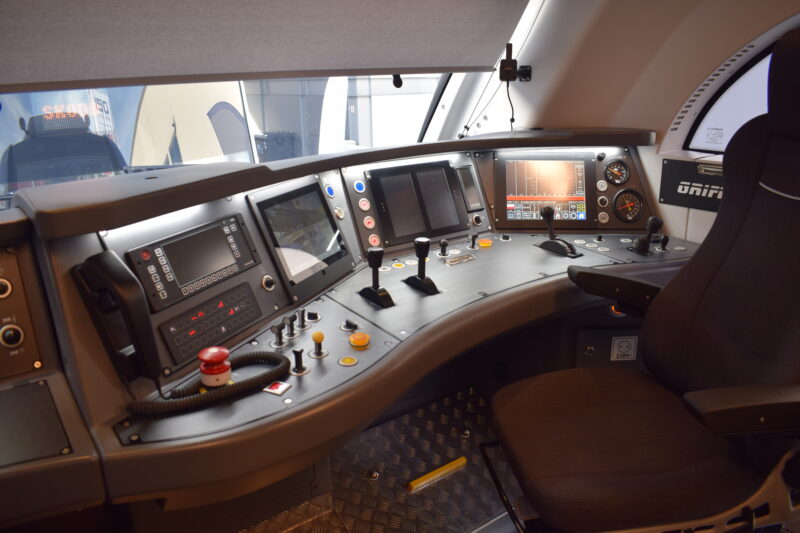 A look inside the Griffin's cab. The driver's desk combines several touchscreen displays with traditional controls and gauges, laid out in an ergonomic curve around the driver's seat