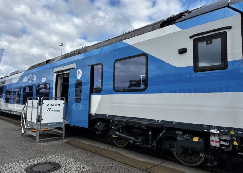 A side view of the Coradia Stream IC at InnoTrans 2026, showing the step-free, wide-door entrance designed for straightforward boarding across all passenger groups.