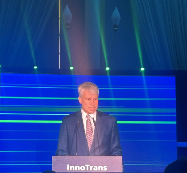 Steffan Bilger addresses attendees from the InnoTrans podium during the opening ceremony