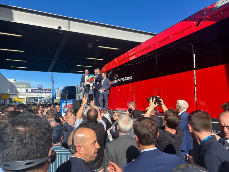 Crowds gather as Stadler and SBB Cargo representatives unveil the Euro Dufour on the InnoTrans outdoor display