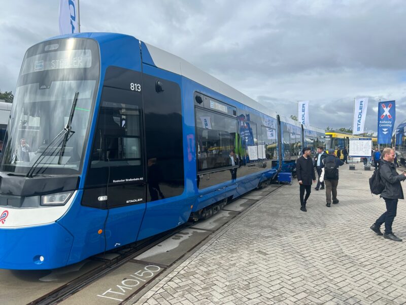 Stadler's TINA tram for Rostocker Straßenbahn AG on the outdoor display at InnoTrans 2026, where visitors could tour the 32.25-metre vehicle inside and out