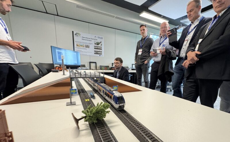 TÜV SÜD employees inspecting a rail vehicle