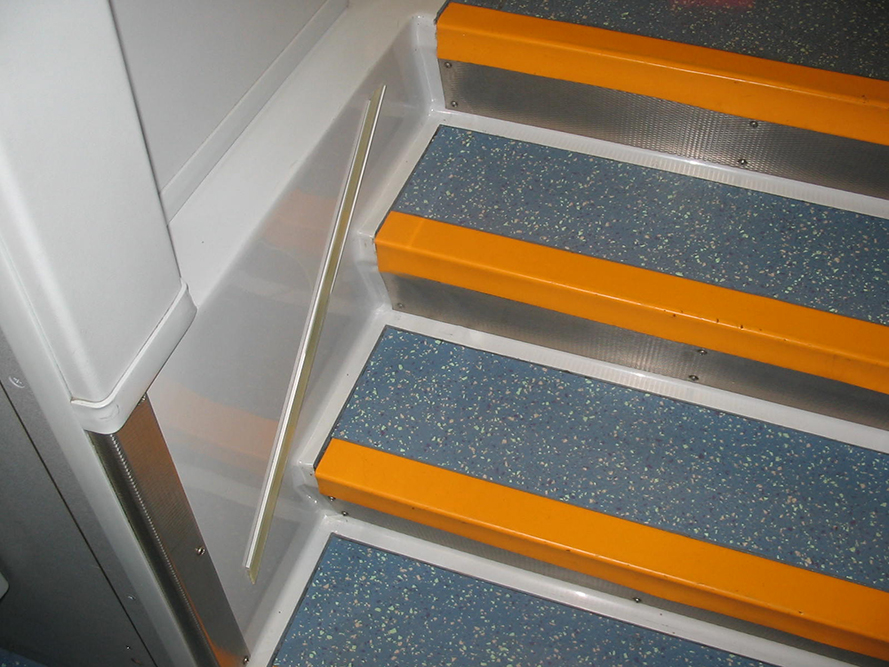 Transit vehicle stairwell made by INPS with orange step edges