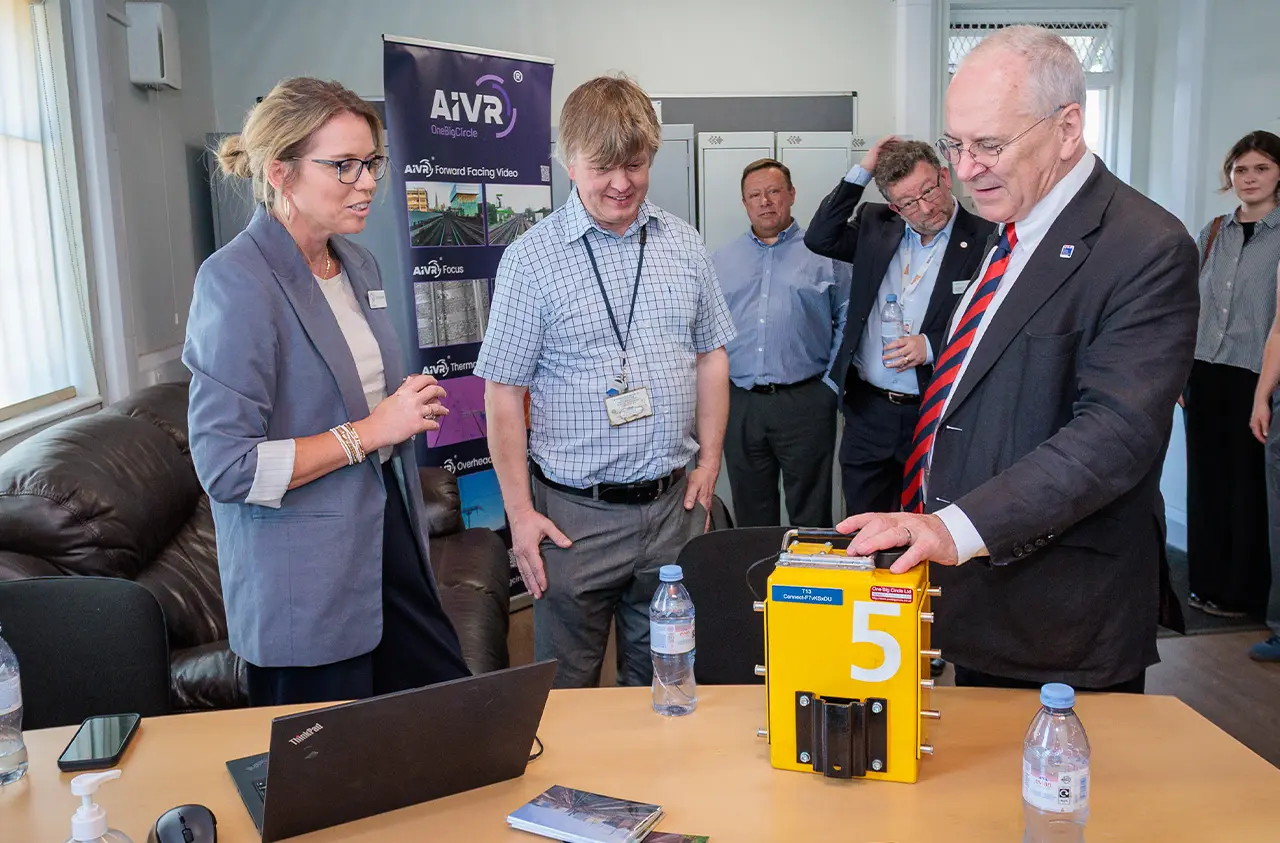 One Big Circle’s Emily Kent showing AIVR equipment to the Rail Minister