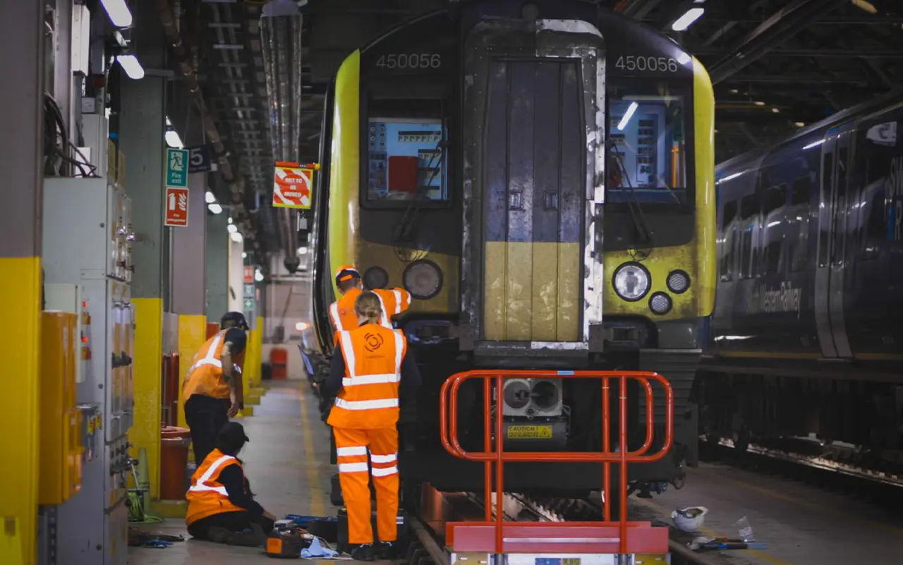 Engineering teams fitting AIVR camera systems to Class 450 train 450056 in the depot