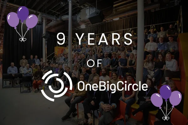 9 Years of One Big Circle graphic with purple balloons over a group photo of the team seated on tiered seating